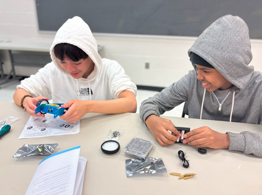 Holmes MS students collaborate to build car robots from Microsoft