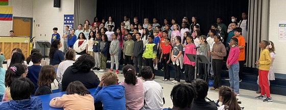 Chorus students performing for students