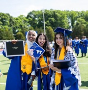 students in their cap and gown at graduation
