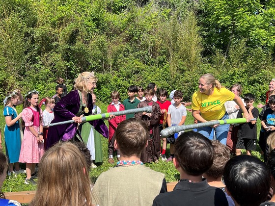 Principal and teacher jousting