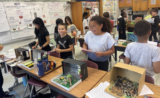 Ms. Brusick's 3rd graders presenting their natural disaster diorama projects to 5th graders