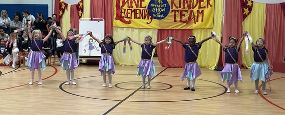 Kindergarten students dancing with ribbons