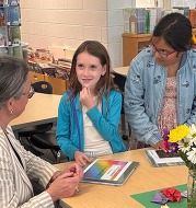 student speaking with Dr. Reid