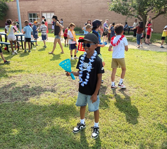2nd grade boy playing a game with a ball