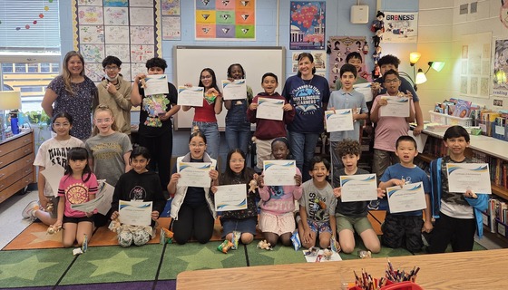 Students holding certificates