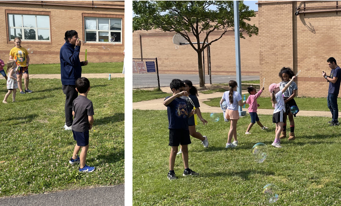 5th graders and kindergarteners playing together outside with bubbles