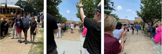 Students leaving the school to get on buses as staff members clap and wave