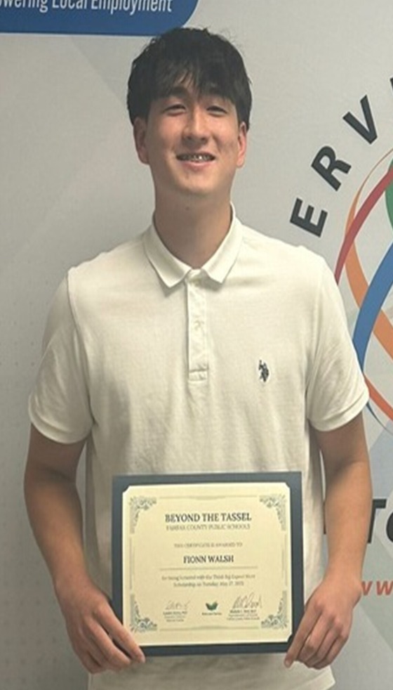 Student holding certificate