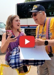 Student standing beside veteran