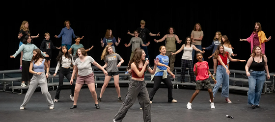 students dancing on stage