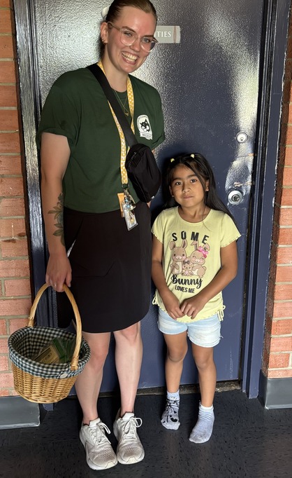 Teacher poses with her student 