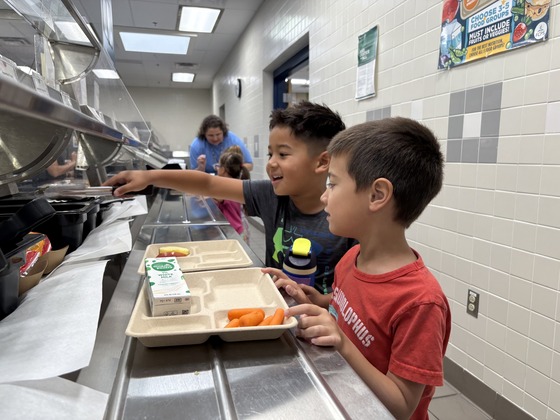 2 students getting lunch at school