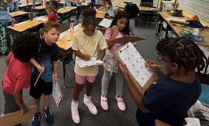 Second graders gather to learn.