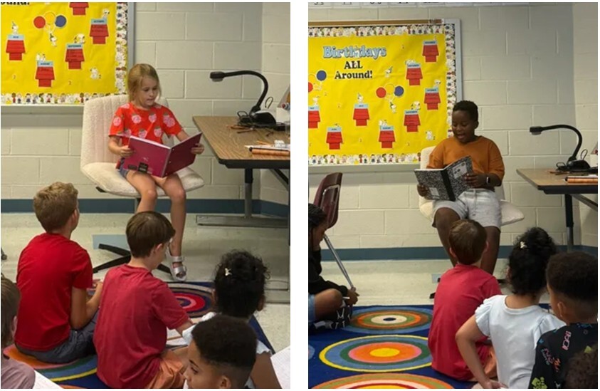 Students sitting in front of the class reading to their classmates