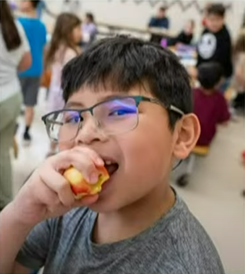 child eating healthy fruit