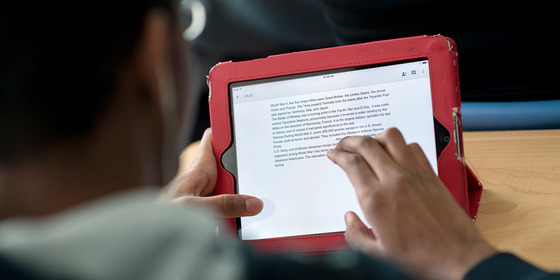 photo of a student's hand using an ipad
