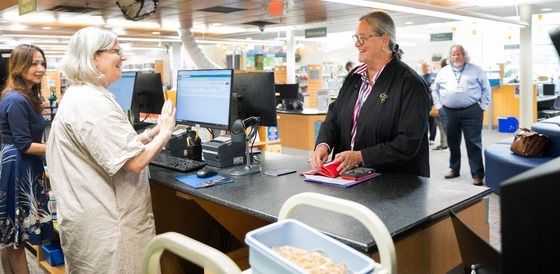 Dr. Reid checking out at the public library