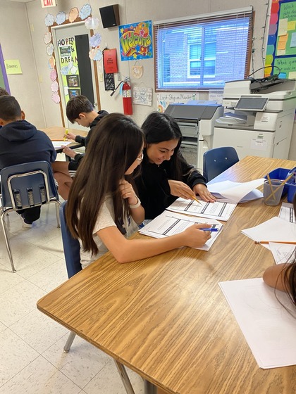 Two students work together on a project 