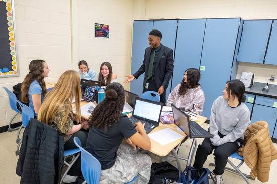 Justin Simmons stands before a group of students
