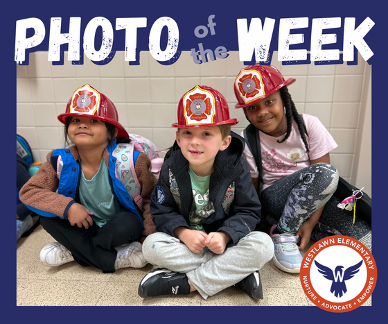 students wear plastic fire hats they received during a field trip