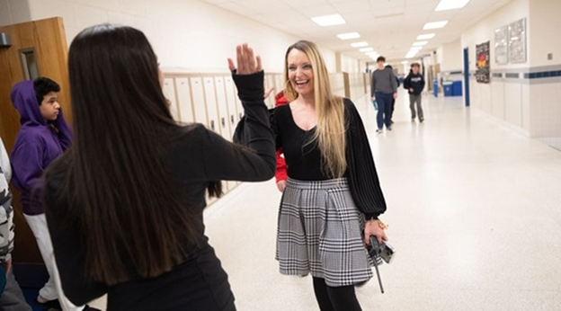 principal high-fiving student