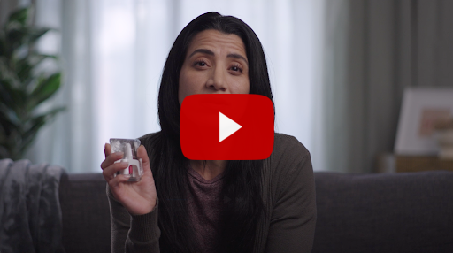 Woman holding naloxone