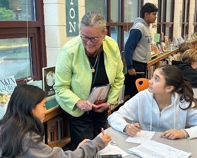 Dr. Reid chats with students