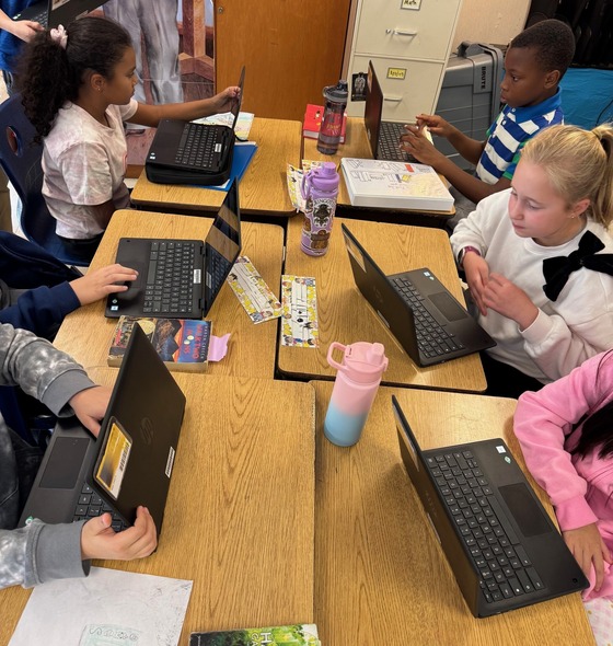 students working on their laptops