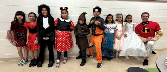 students in book costumes