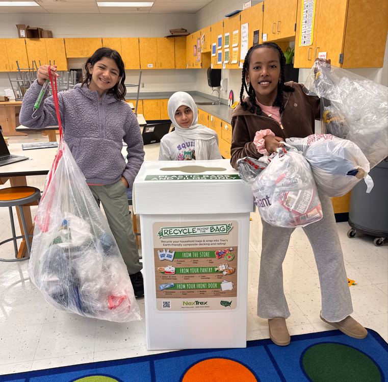 HMES students helping with recycling plastic