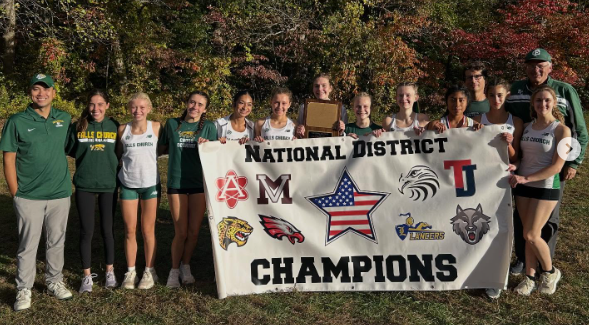 FCHS Girls Cross Country Team posing with National District Championship banner