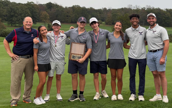 Edison's Golf Team posing with National District Championship plaque