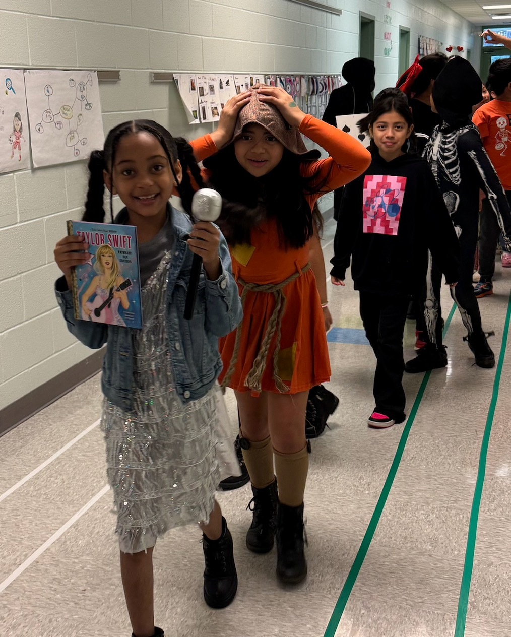 Students walk in the storybook character parade 