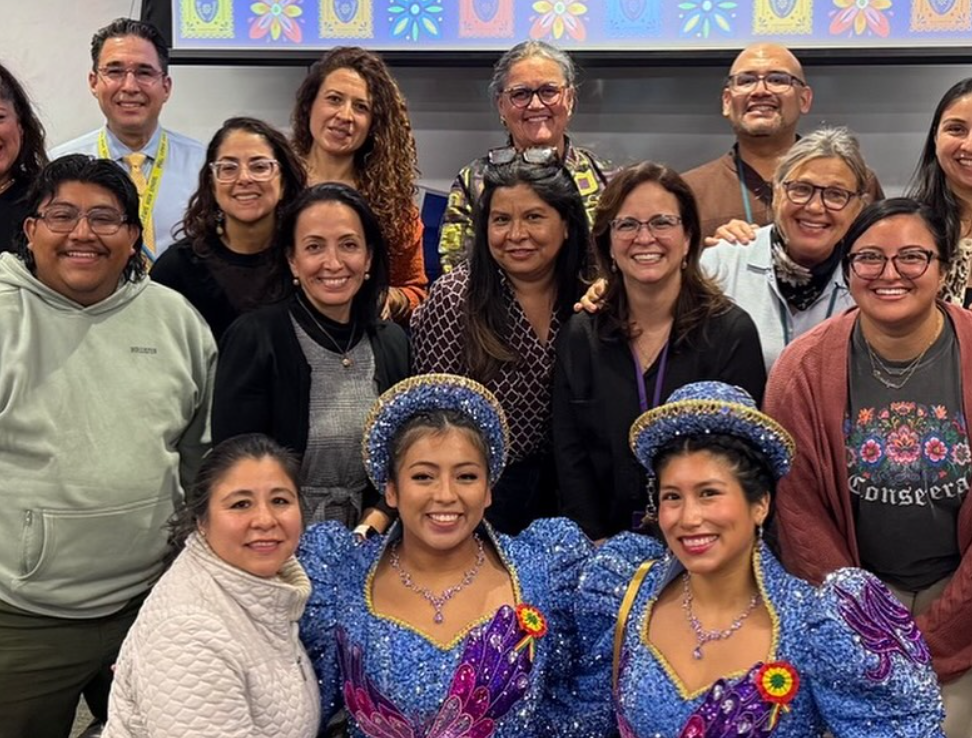 group of people smiling for a photo