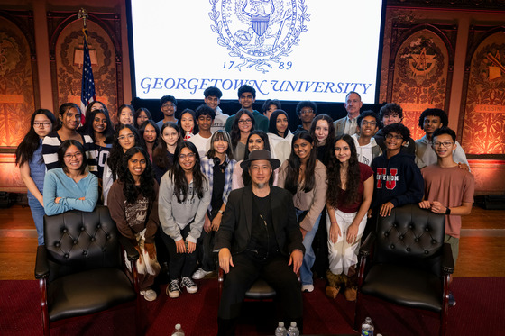 TJ Students from AI in Society Club standing on stage with Professor De Kai
