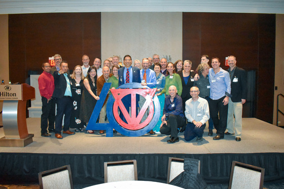 Class of 1989 poses on stage at 40th Anniversary Celebration Banquet