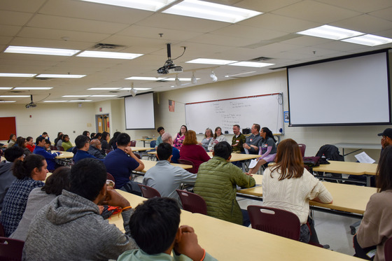 Students listening to alumni speak at TJ Open House networking event