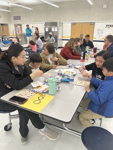 Families playing bingo at PTA Bingo Night