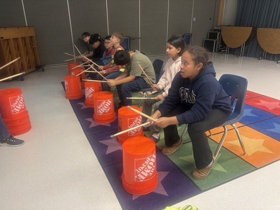 Students are bucket drumming 