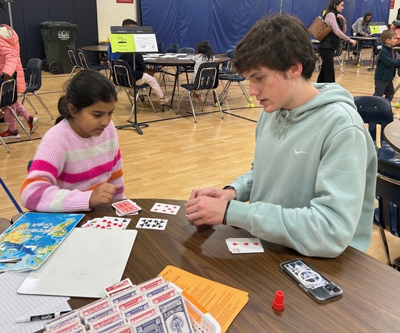 Two students playing a math game