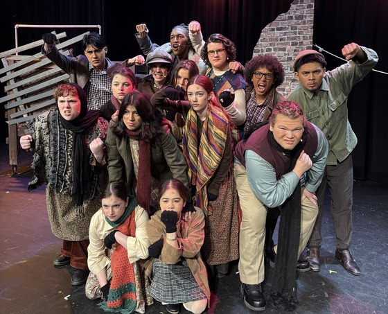 Cast of Annie on stage