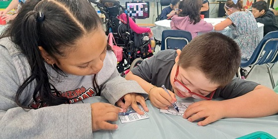 two students crafting together