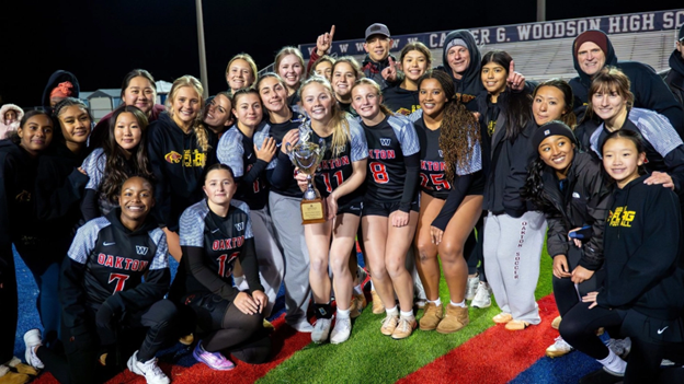 Oakton Flag Football team standing and kneeling together in group