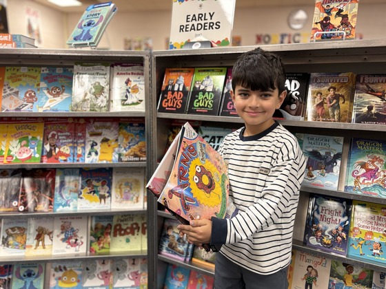 Student shopping at Book Fair 