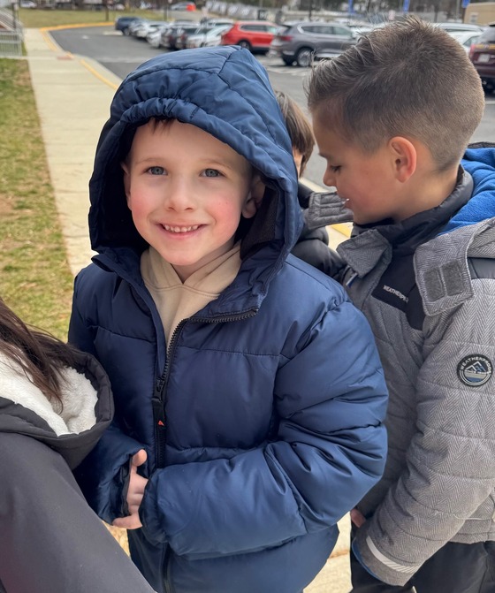 student in winter coat