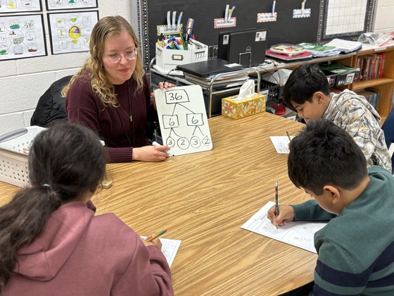 Teacher working with small group of students 