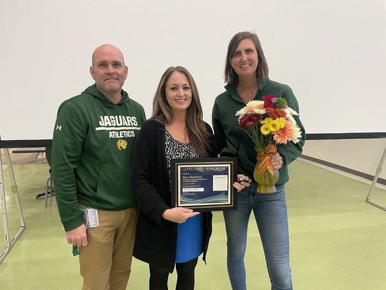 teacher with her award
