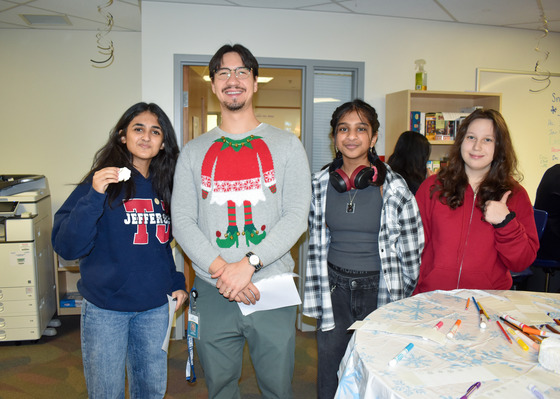 Students pose with counselor and cookies at Cookiepalooza