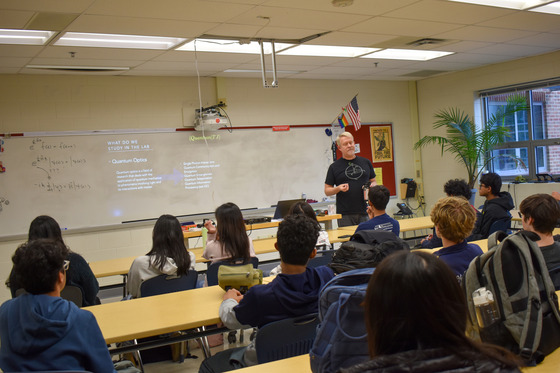 Juniors listen intently to see what research in the Quantum lab is like.