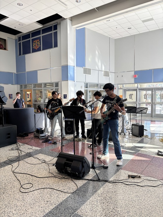Guitar club performing in Nobel Commons during lunch for students